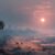 恐竜絶滅後の地球の風景。薄暗い空と荒れた大地に沈む夕日。